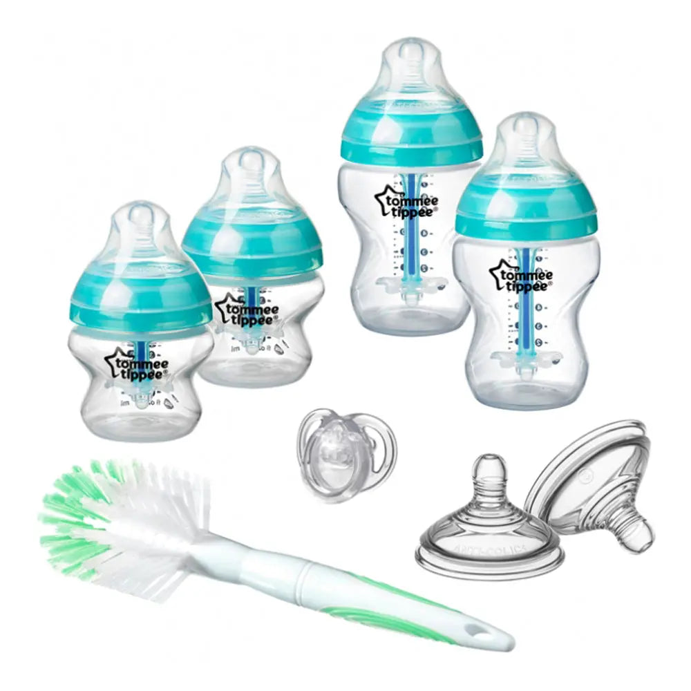 Contents of the blue Tommee Tippee starter set: four anti-colic bottles, spare teats, brush and soother